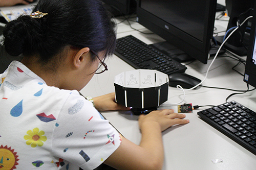 A participant enjoying their just completed zoetrope